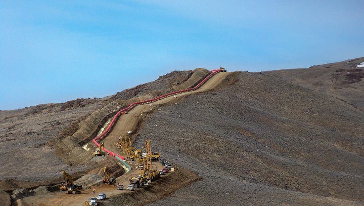 Mainline pipeline crossing open hill country