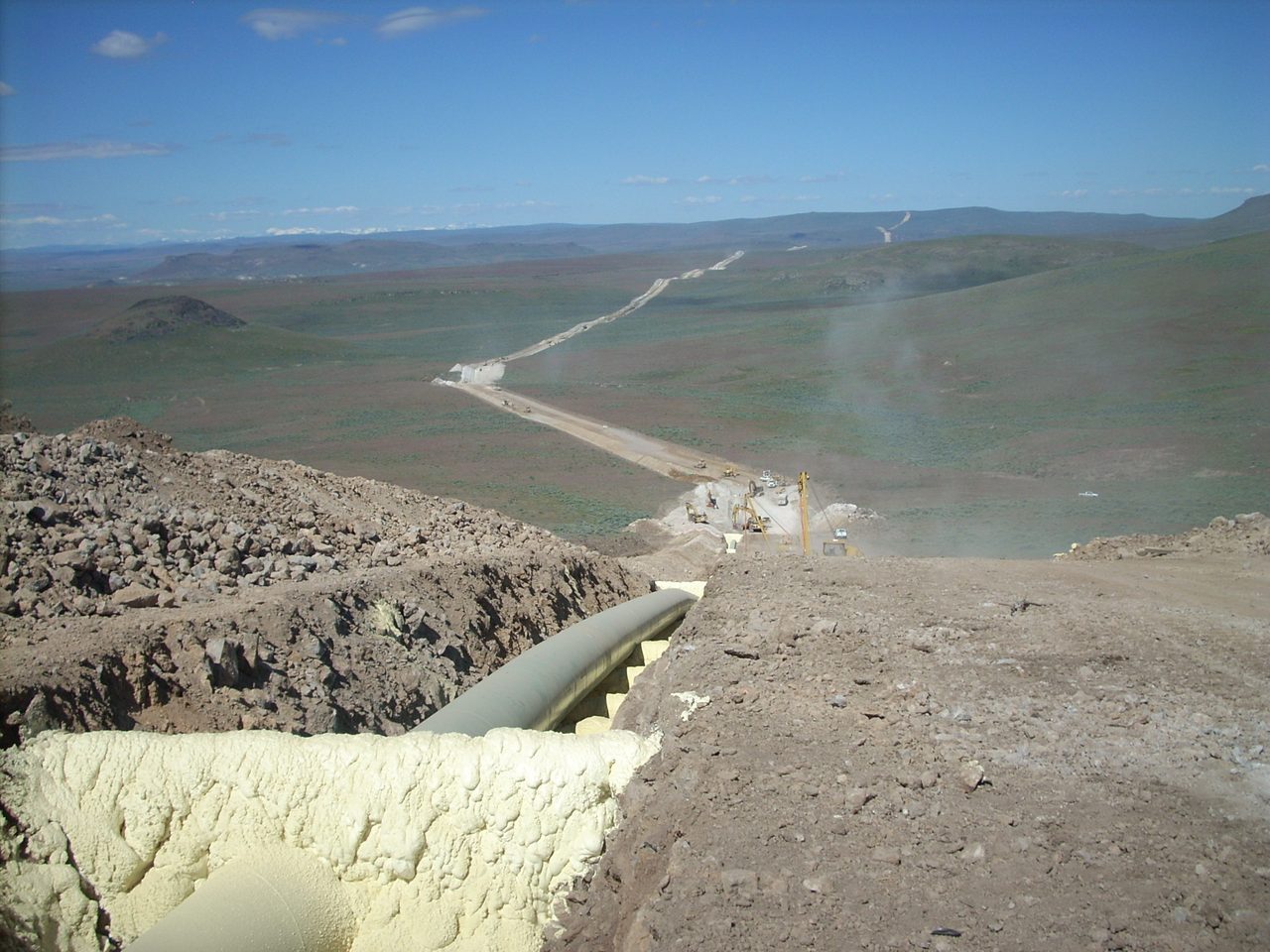 Pipeline route descending into a valley